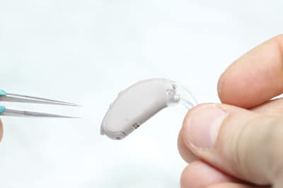Regular Hearing Aid Servicing and Repairs Audiologist Performs Hearing Aid Servicing